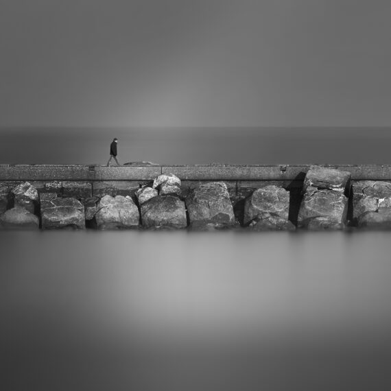 man walking on the pier of Velsen