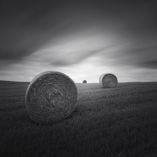 Three hay bales in germany with nice sky